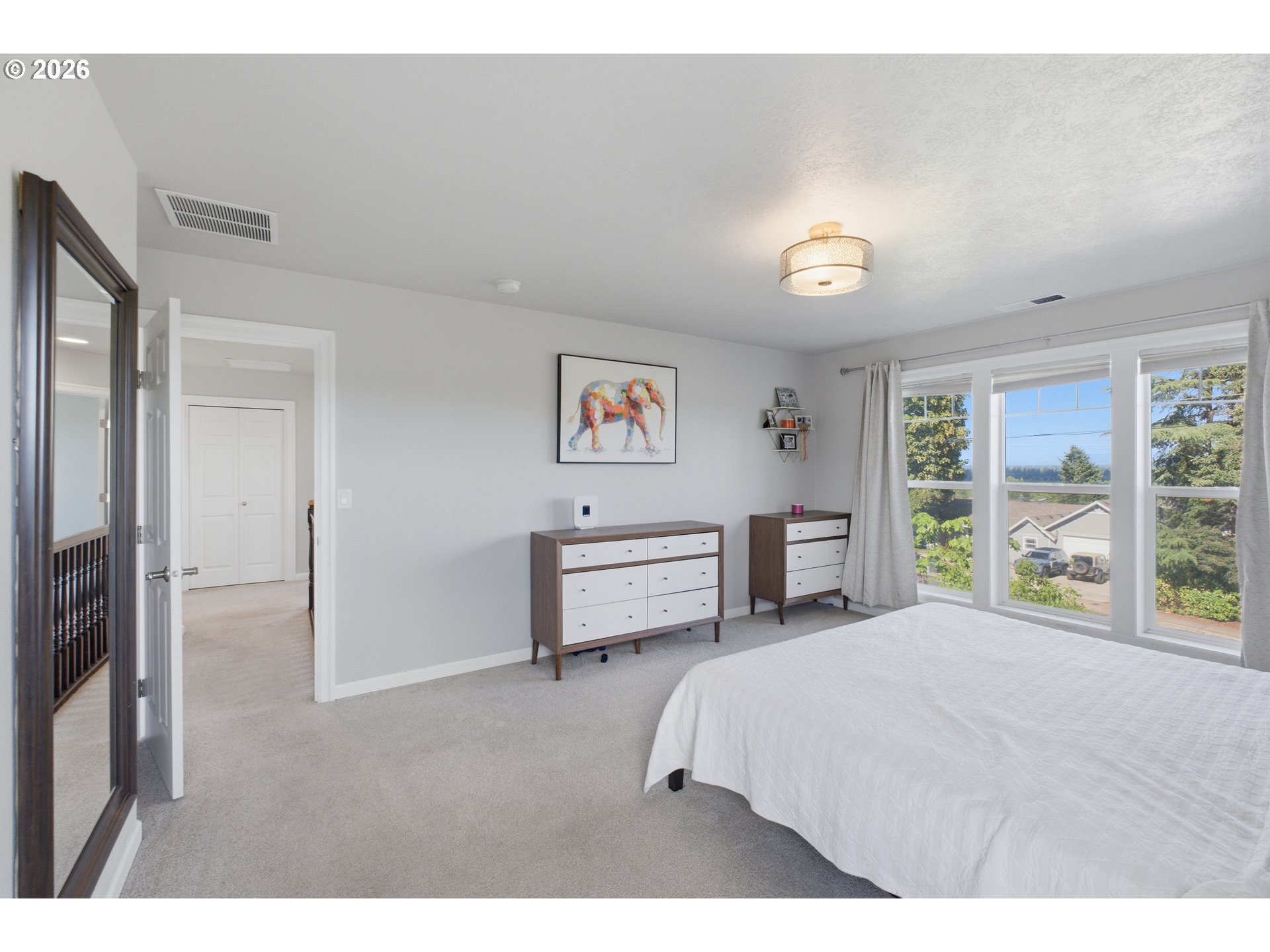 2925 Doaks Ferry Road Northwest Salem, OR 97304 - Photo 29 of 47 a bedroom with a bed and a large window