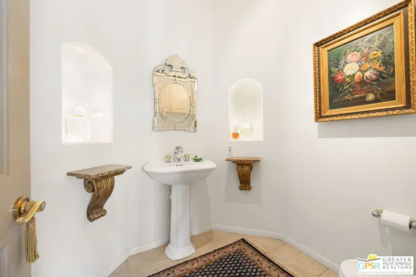 a bathroom with a sink and mirror