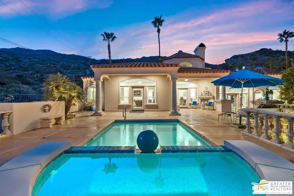 a swimming pool with outdoor seating yard