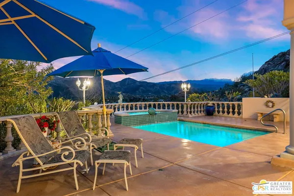 a view of a chairs and table in the patio