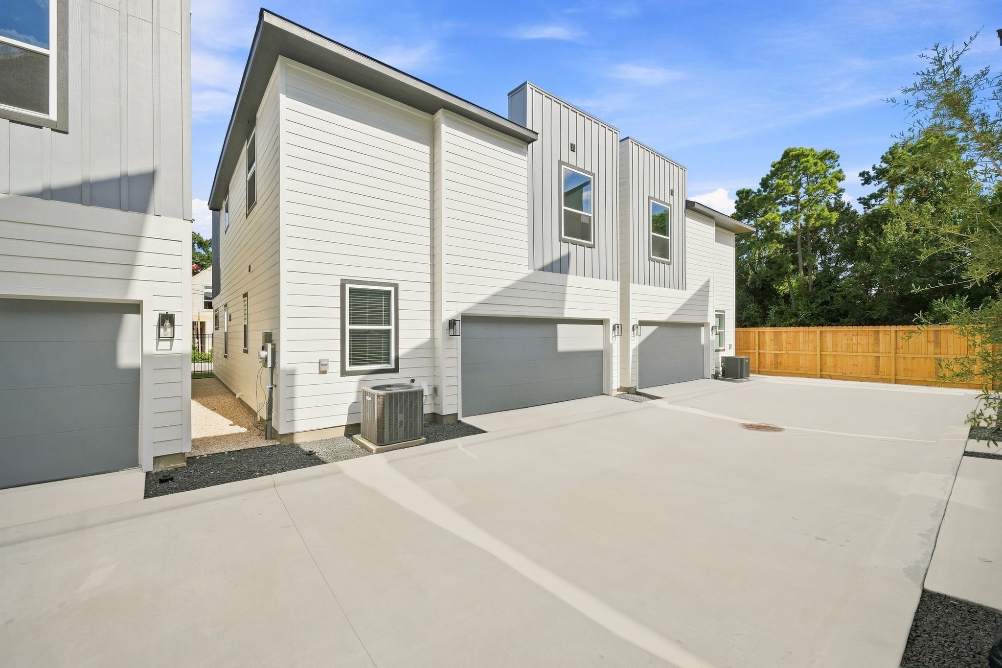6063 Cebra Street Houston, TX 77091 - Photo 10 of 50 Another view of the private community drive and rear-entry garages, showcasing the clean, thoughtfully designed layout of Highland Heights Crossing.