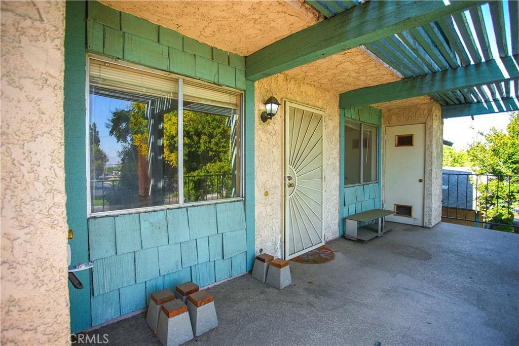 an outdoor view of a house with a garden