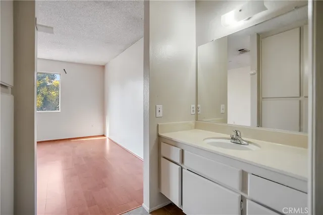 a bathroom with a sink double vanity and a mirror