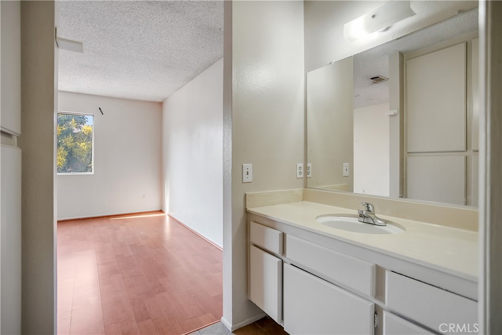 2321 Gonzaga Lane Riverside, CA 92507 - Photo 18 of 24 a bathroom with a sink double vanity and a mirror