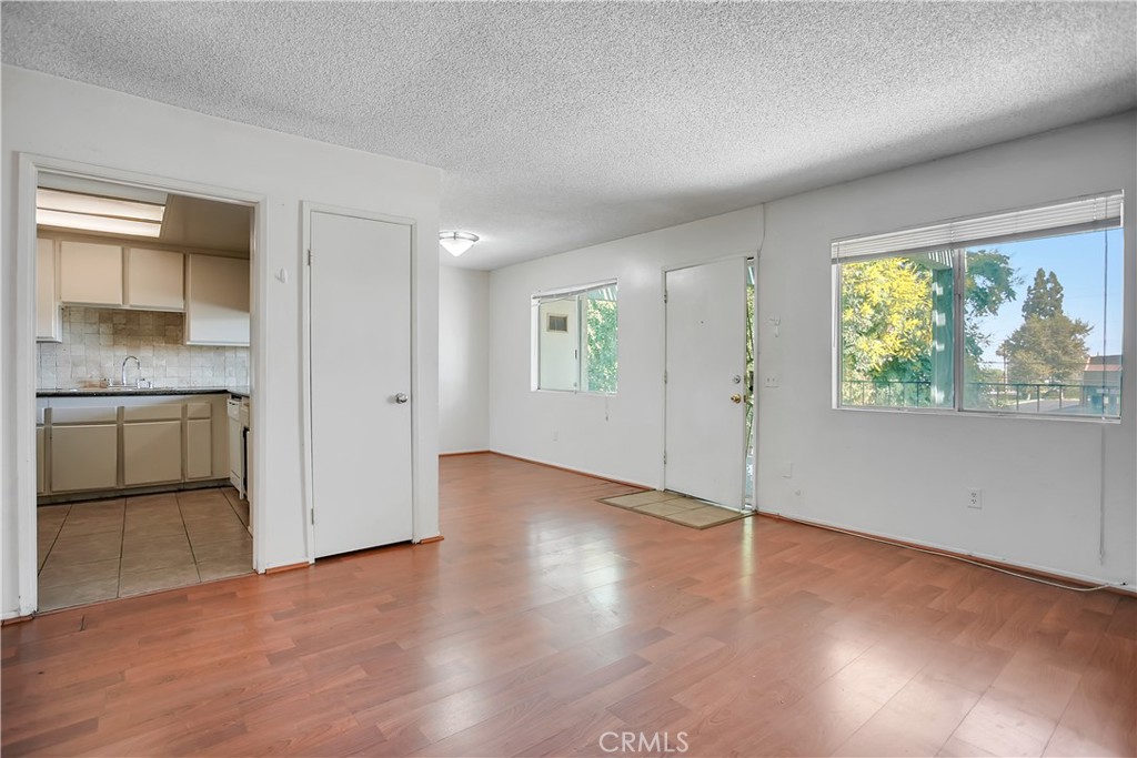 2321 Gonzaga Lane Riverside, CA 92507 - Photo 4 of 24 wooden floor in an empty room with a window