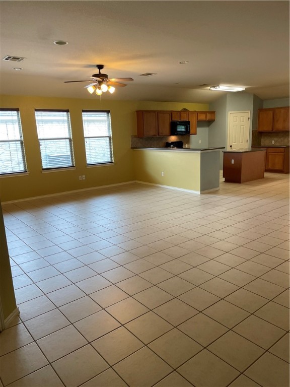 9504 Castle Pines Drive Austin, TX 78717 - Photo 2 of 12 a view of a kitchen with natural light