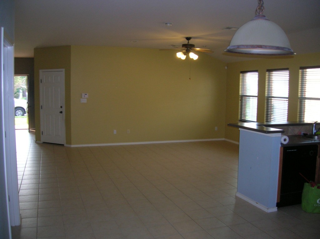 9504 Castle Pines Drive Austin, TX 78717 - Photo 6 of 12 en empty room with window and wooden floor