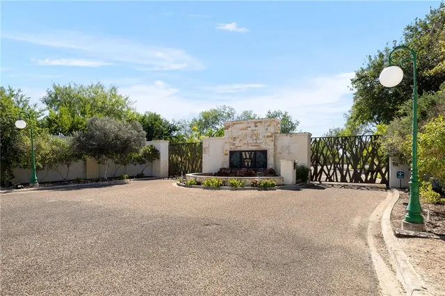 a view of a house with a basketball court