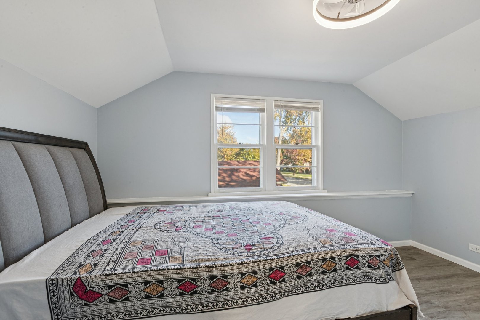 8846 Austin Avenue Morton Grove, IL 60053 - Photo 17 of 35 a bedroom with a bed and a window