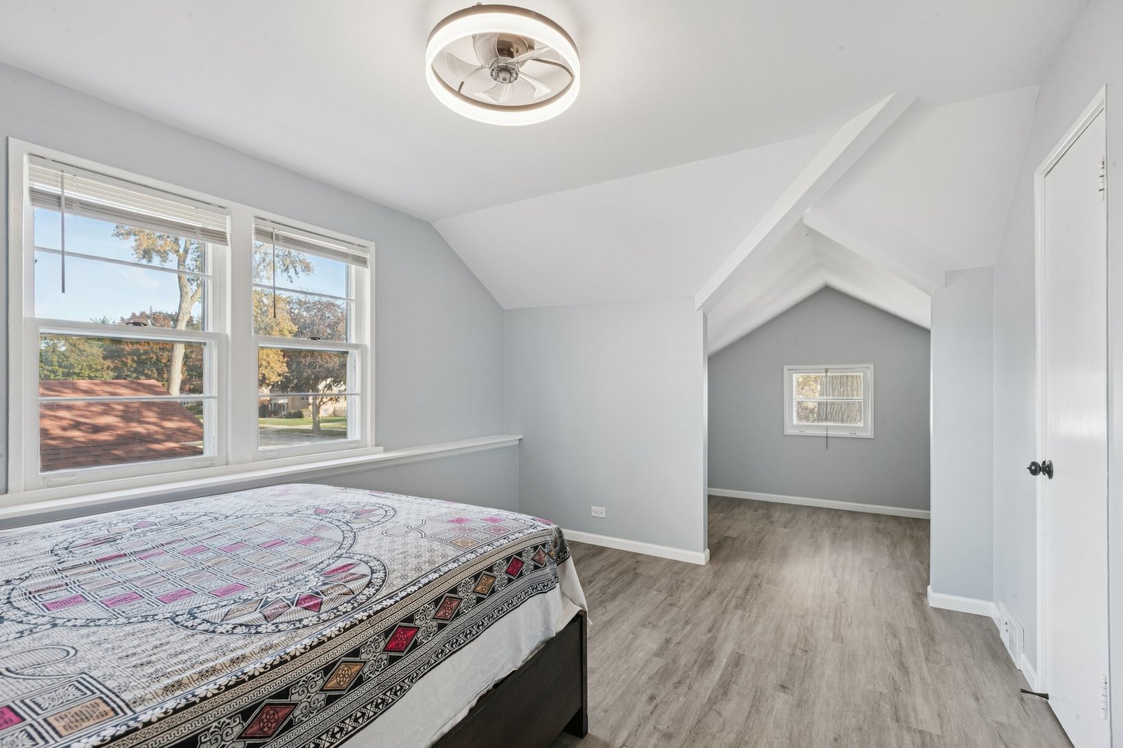 8846 Austin Avenue Morton Grove, IL 60053 - Photo 18 of 35 a bedroom with a bed and a window