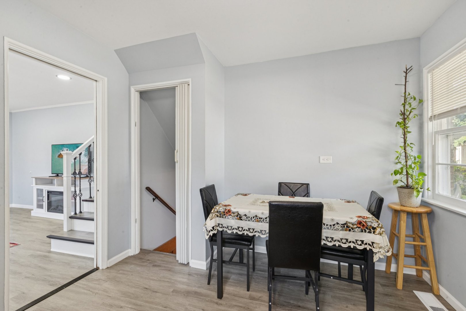 8846 Austin Avenue Morton Grove, IL 60053 - Photo 6 of 35 a view of a dining room with furniture and wooden floor