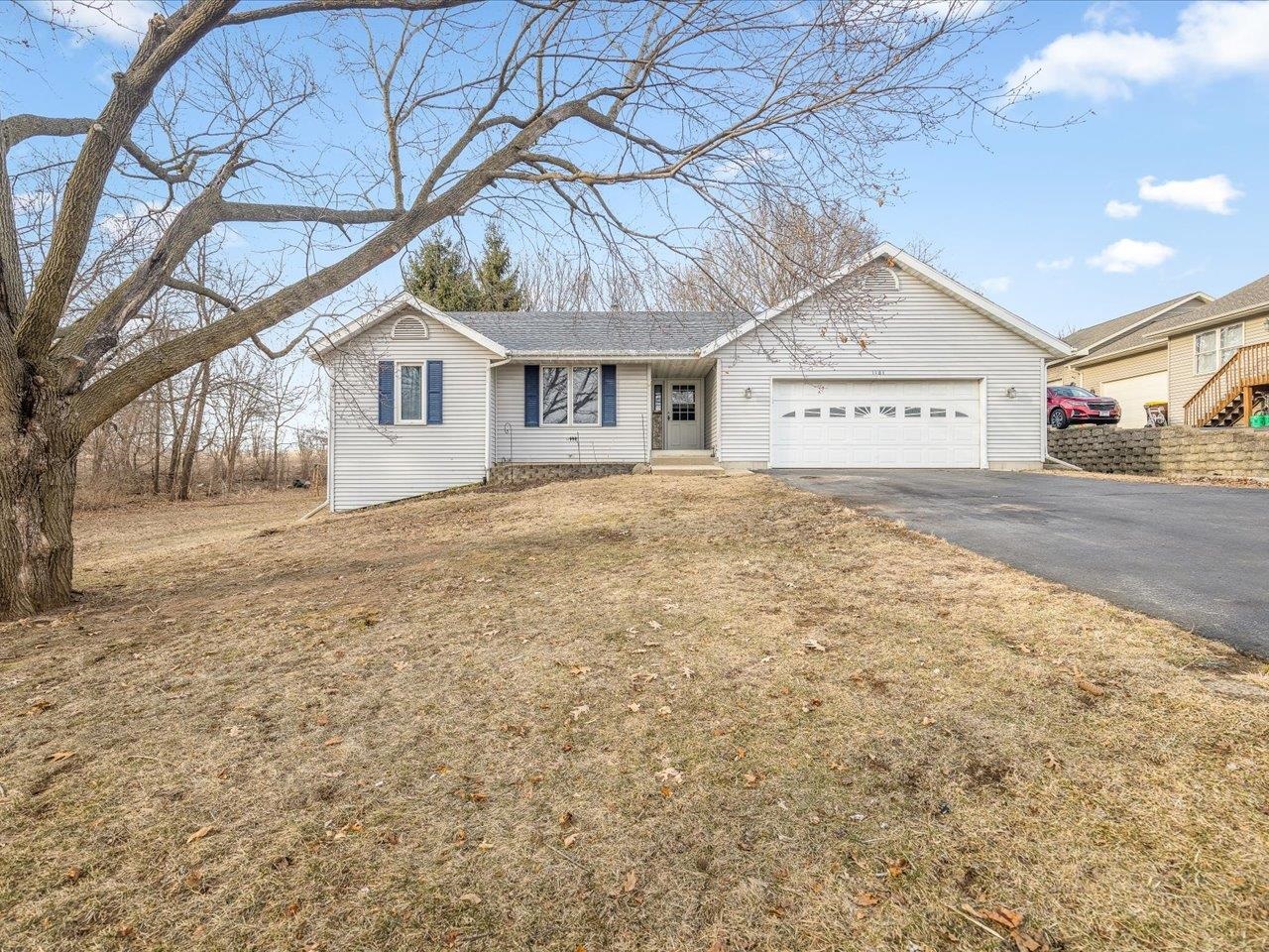 1101 Drexel Road Lake Summerset, IL 61019 - Photo 2 of 34 a front view of a house with a yard and garage