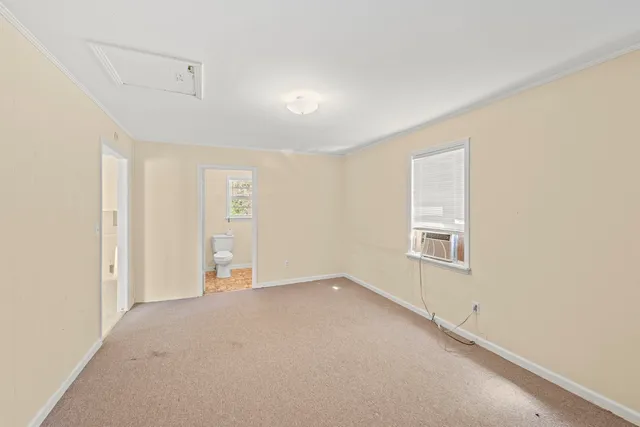 an empty room with a empty space and windows