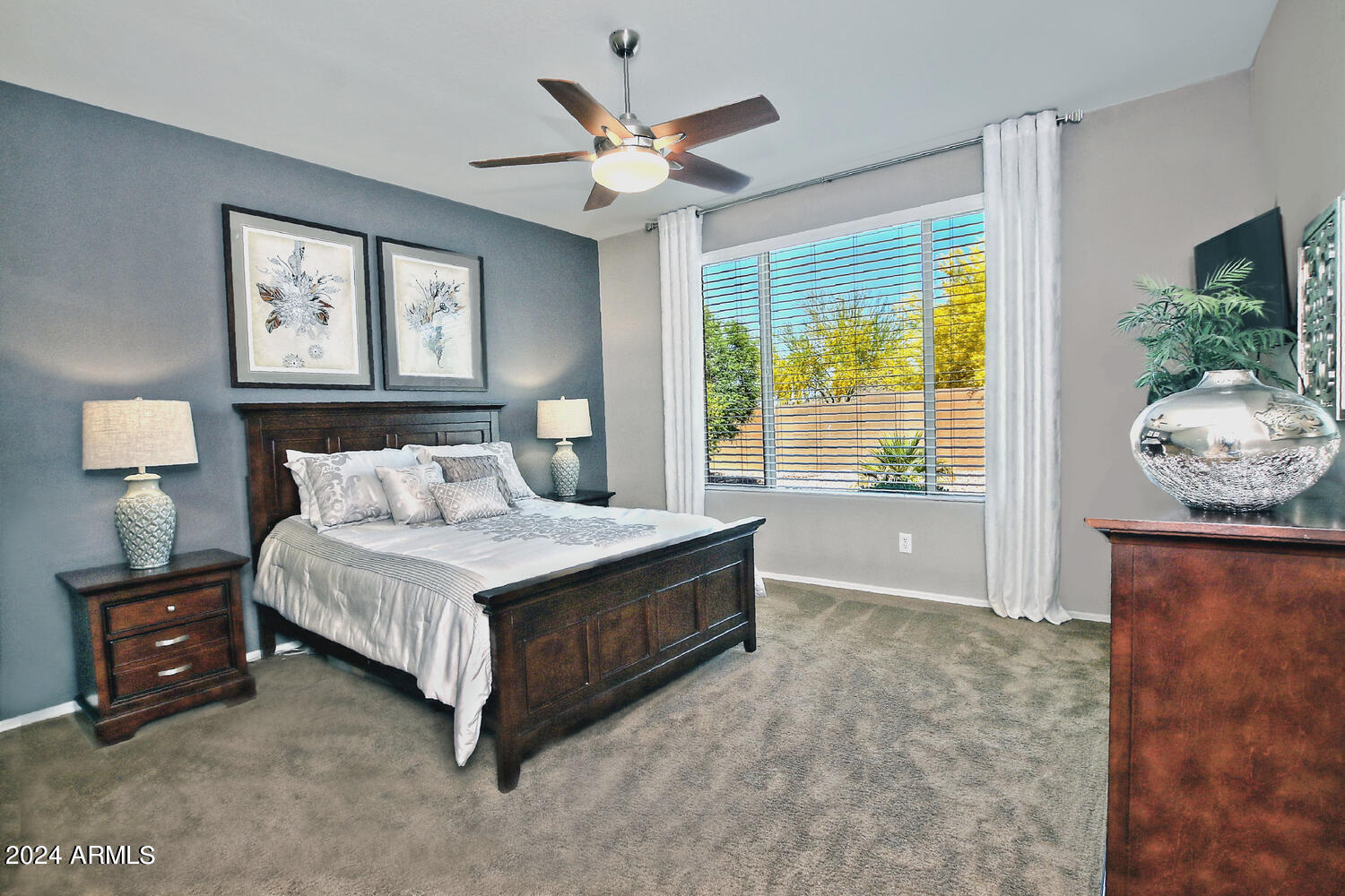 4394 North Hummingbird Drive Florence, AZ 85132 - Photo 15 of 32 a bedroom with a bed and a window