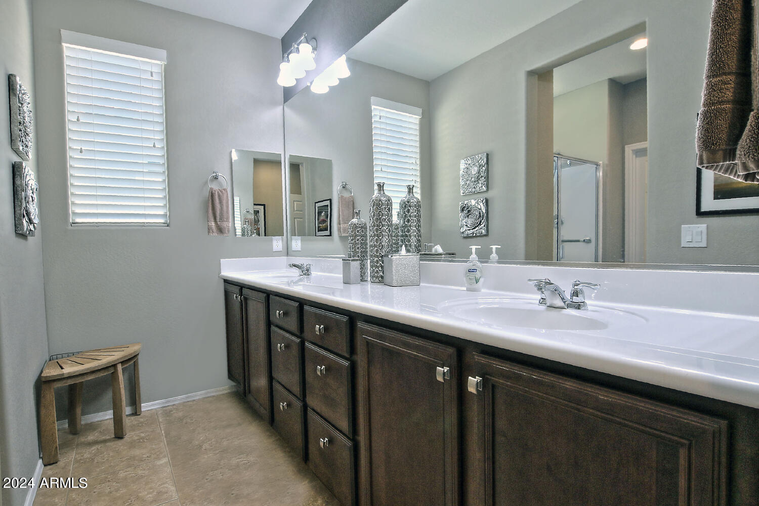 4394 North Hummingbird Drive Florence, AZ 85132 - Photo 18 of 32 a bathroom with a sink double vanity and a mirror