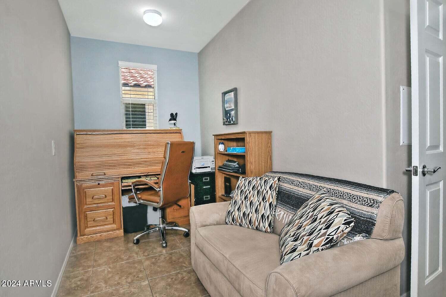 4394 North Hummingbird Drive Florence, AZ 85132 - Photo 25 of 32 a bedroom with a bed and furniture