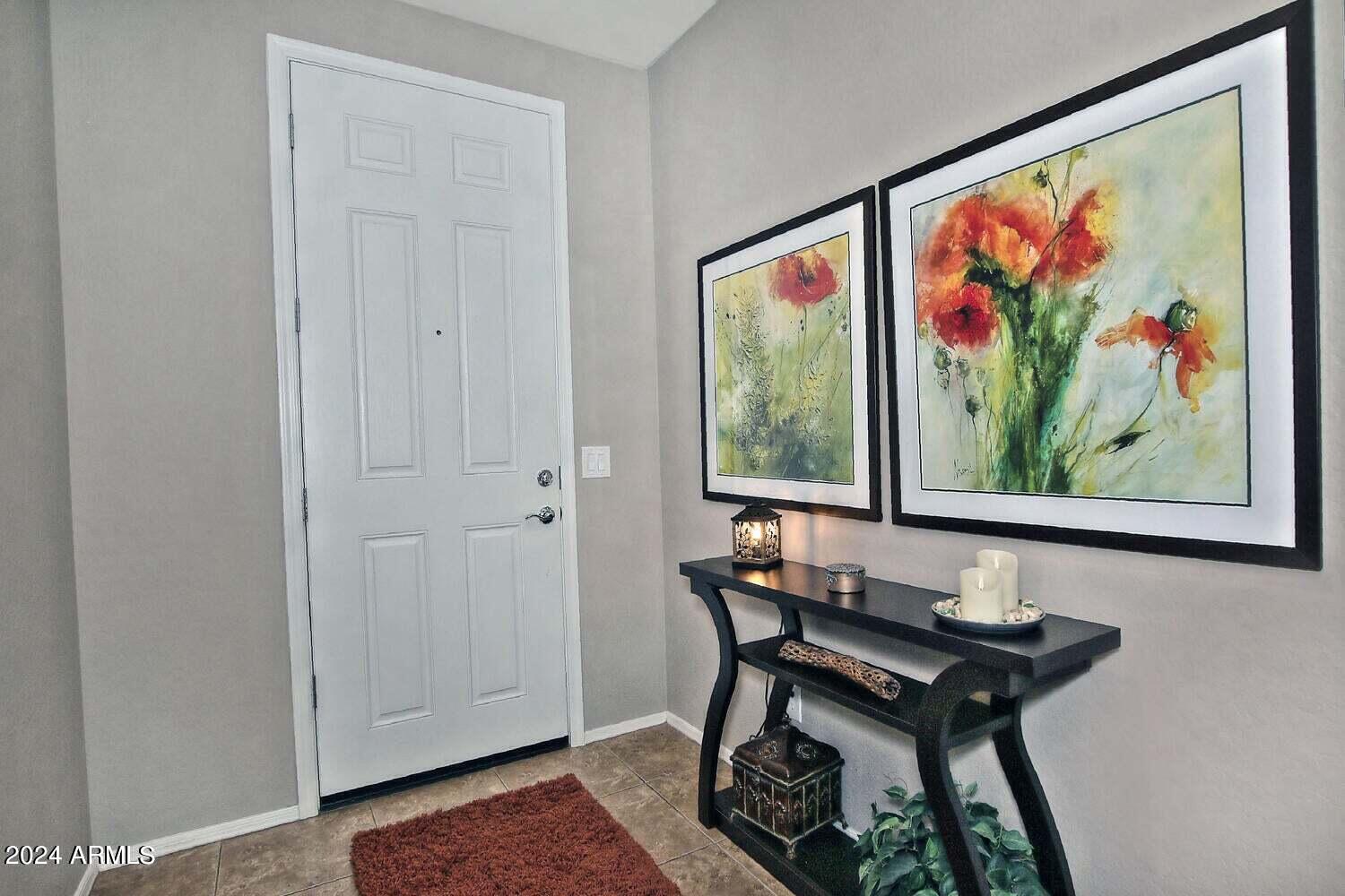 4394 North Hummingbird Drive Florence, AZ 85132 - Photo 3 of 32 a view of a dining room with furniture and wooden floor