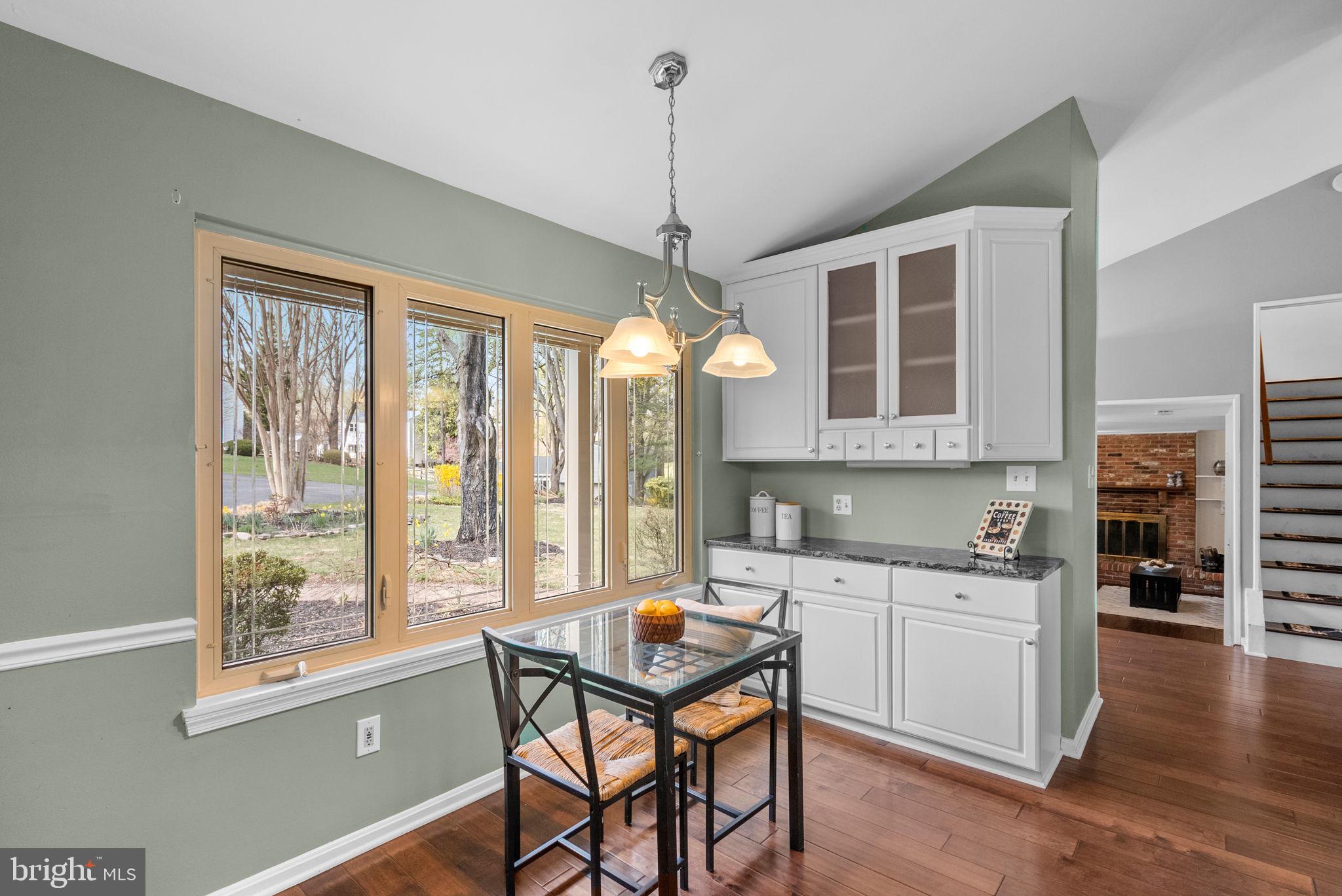 9828 Moyer Road Damascus, MD 20872 - Photo 18 of 46 a kitchen with a window a sink and chairs