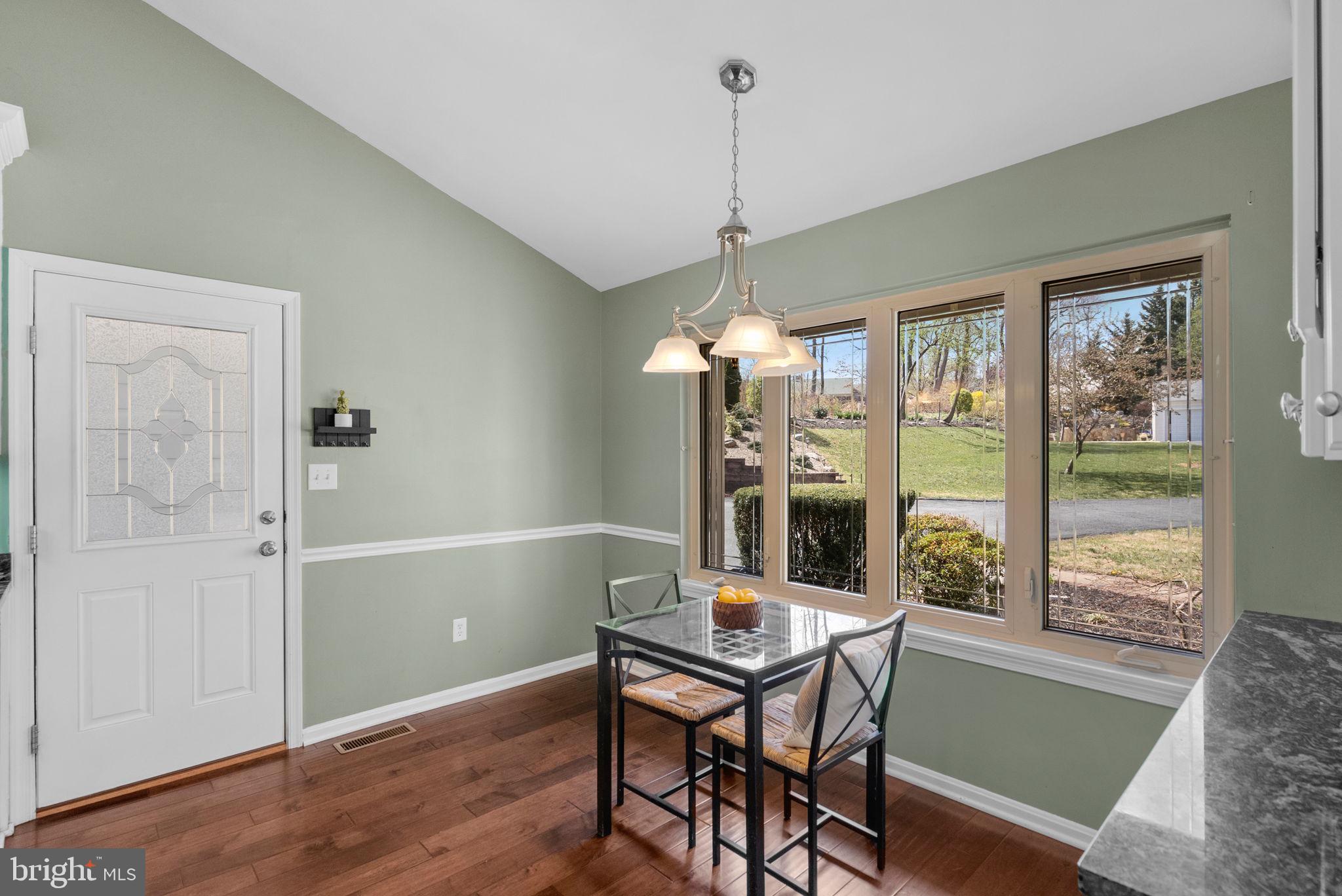 9828 Moyer Road Damascus, MD 20872 - Photo 20 of 46 a view of a dining room with furniture window and wooden floor