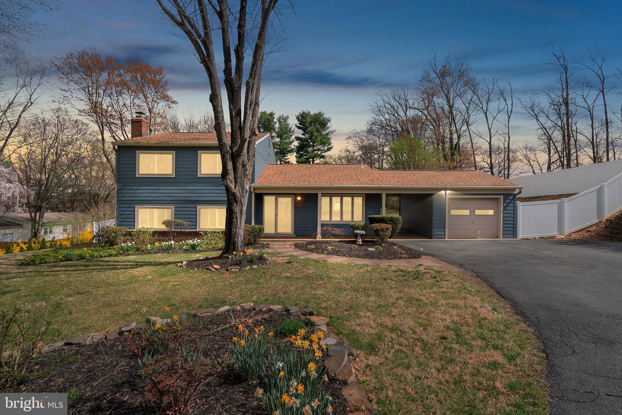 9828 Moyer Road Damascus, MD 20872 - Photo 2 of 46 a front view of a house with yard and seating area
