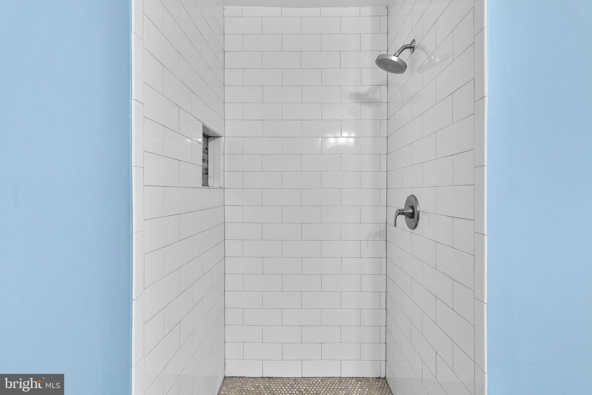 9828 Moyer Road Damascus, MD 20872 - Photo 25 of 46 a bathroom with a shower