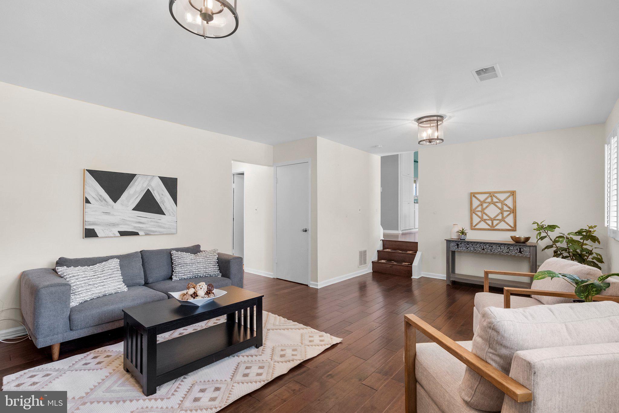 9828 Moyer Road Damascus, MD 20872 - Photo 35 of 46 a living room with furniture and wooden floor