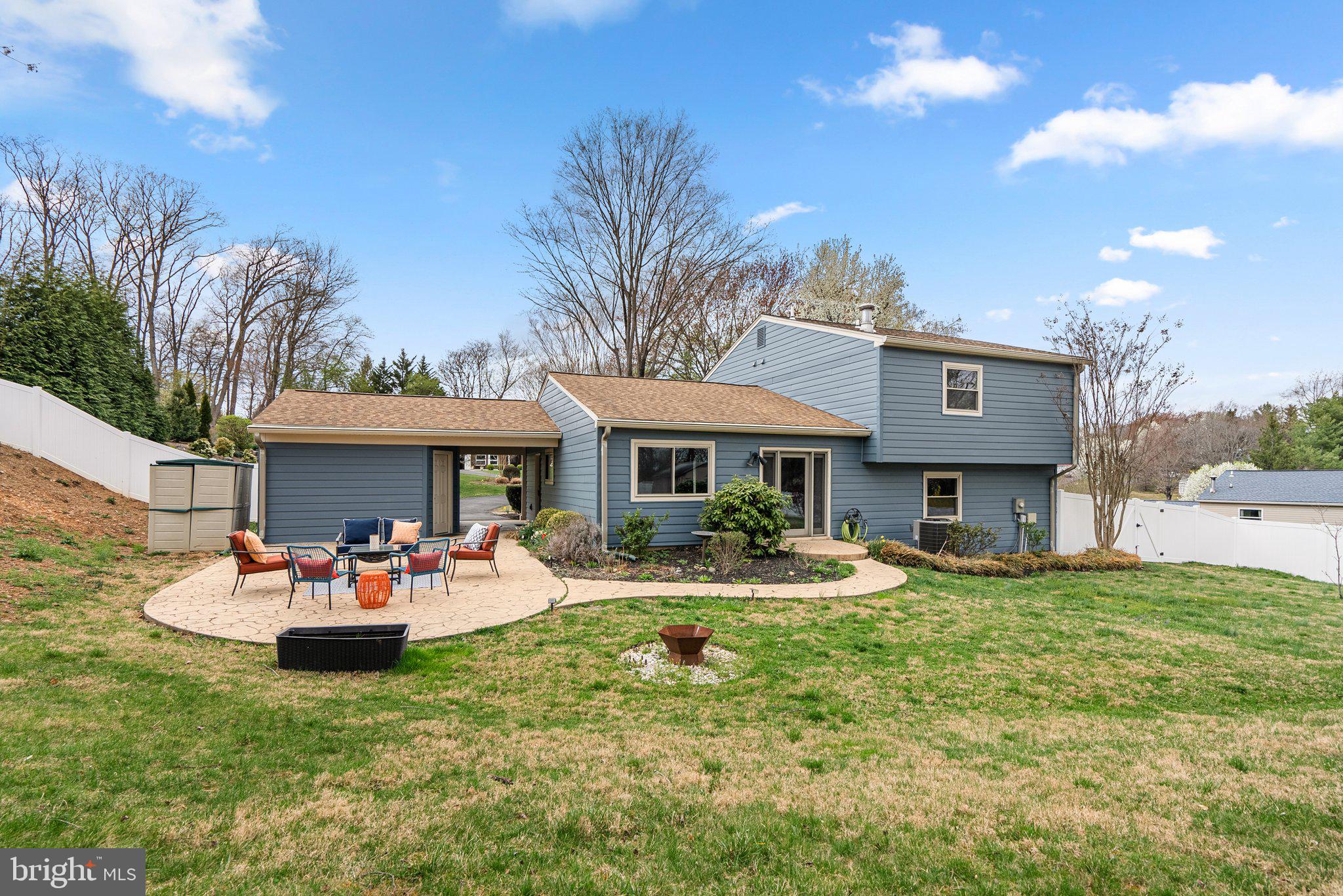 9828 Moyer Road Damascus, MD 20872 - Photo 42 of 46 a front view of a house with garden