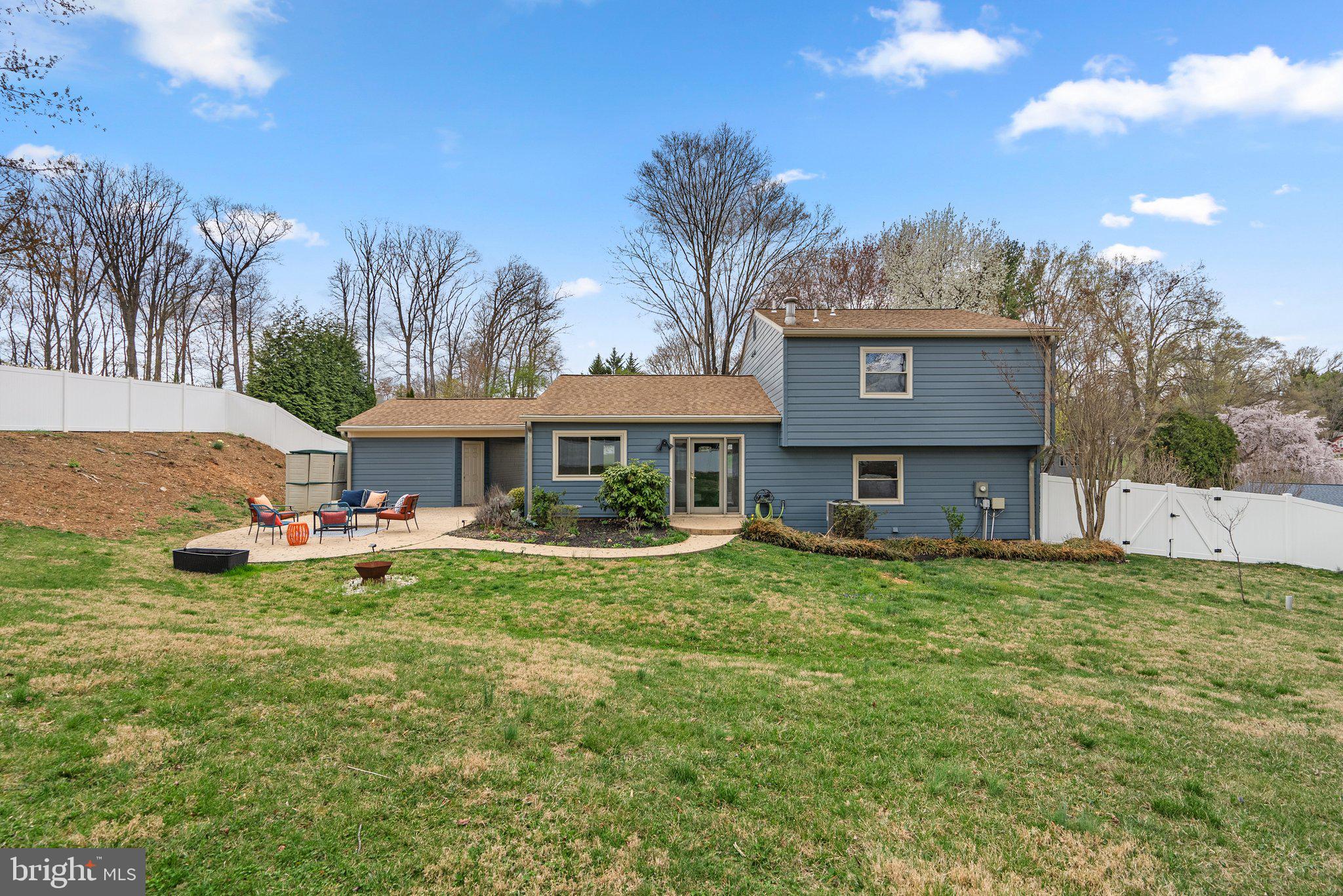 9828 Moyer Road Damascus, MD 20872 - Photo 43 of 46 a front view of a house with garden