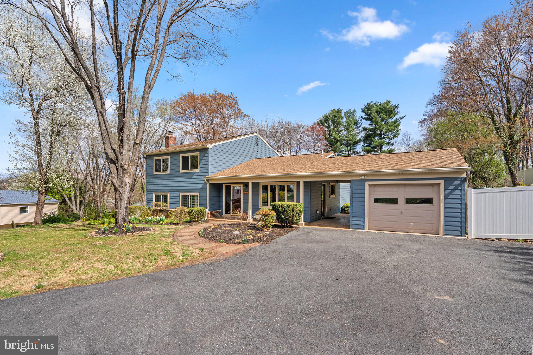 9828 Moyer Road Damascus, MD 20872 - Photo 46 of 46 a front view of a house with a yard