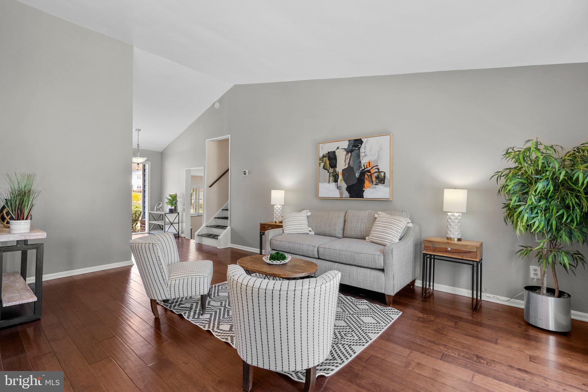 9828 Moyer Road Damascus, MD 20872 - Photo 6 of 46 a living room with furniture and a potted plant