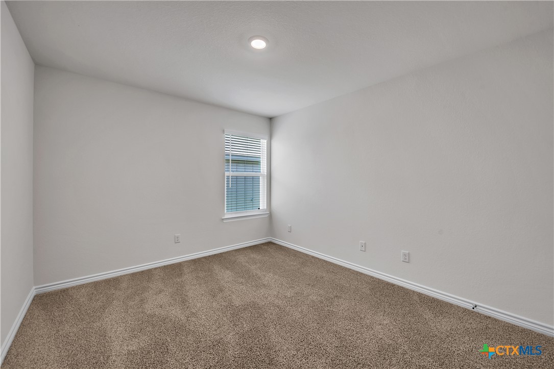 203 Wind Ridge Drive Copperas Cove, TX 76522 - Photo 11 of 16 an empty room with windows