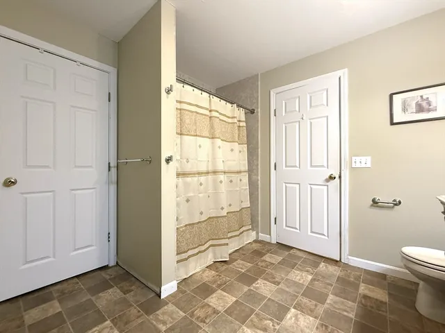 a view of a bathroom with a glass door shower