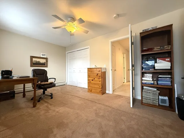 a view of a livingroom with a workspace