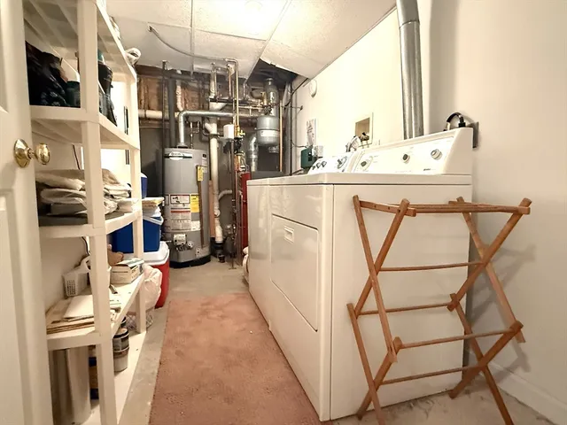 a storage room with water heater and racks