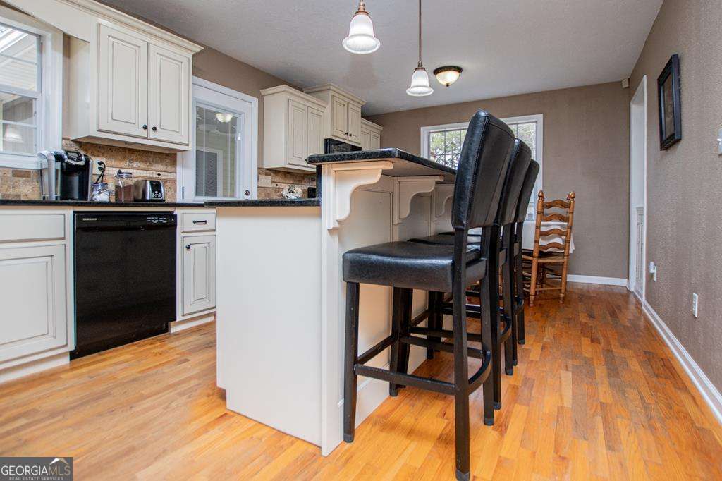 2 Pine Hill Drive Ranburne, AL 36273 - Photo 33 of 91 a kitchen with stainless steel appliances wooden floor and a refrigerator
