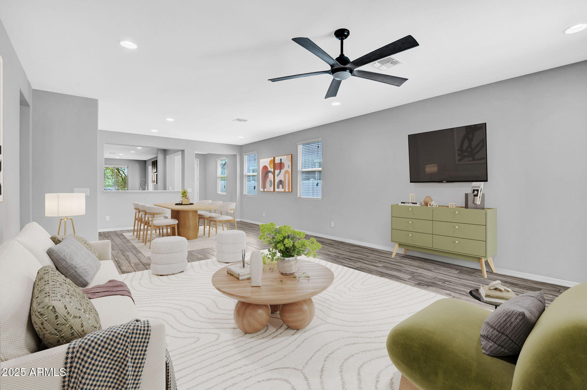 6562 South 24th Place Phoenix, AZ 85042 - Photo 8 of 22 a living room with furniture and a flat screen tv