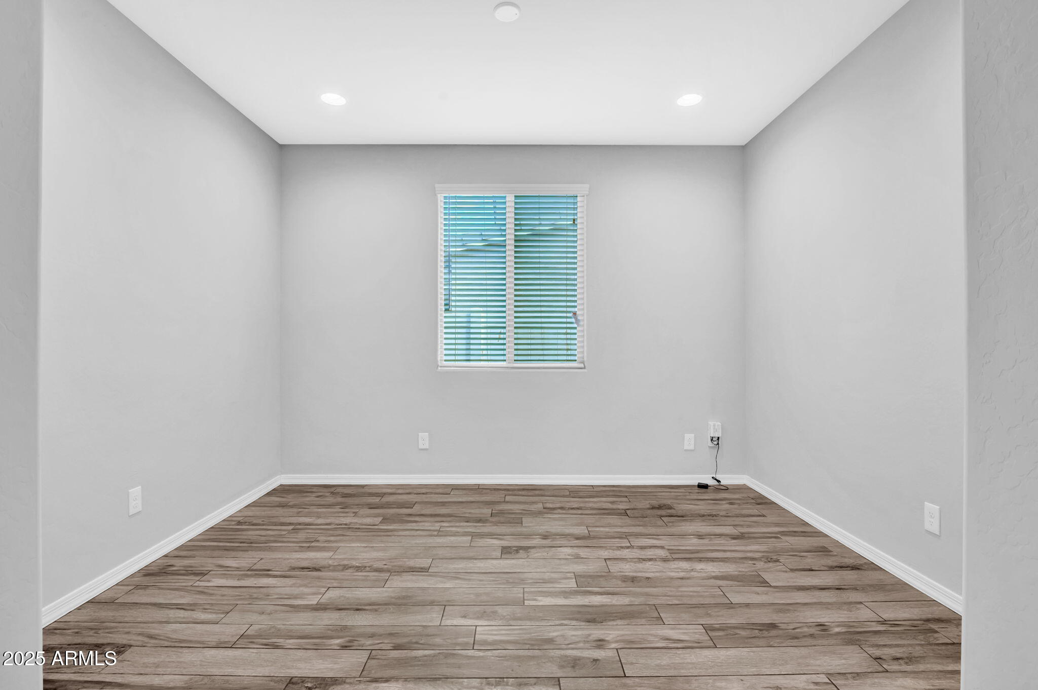 6562 South 24th Place Phoenix, AZ 85042 - Photo 10 of 22 wooden floor in an empty room
