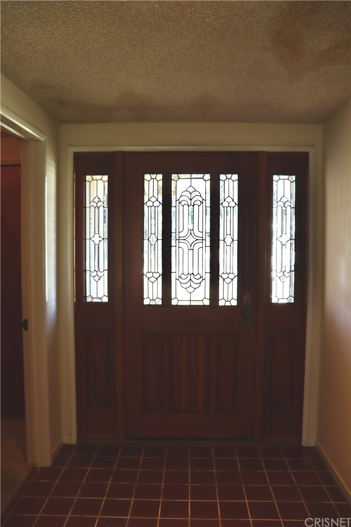 11240 Balcom Avenue Granada Hills, CA 91344 - Photo 18 of 23 view of an empty room with windows