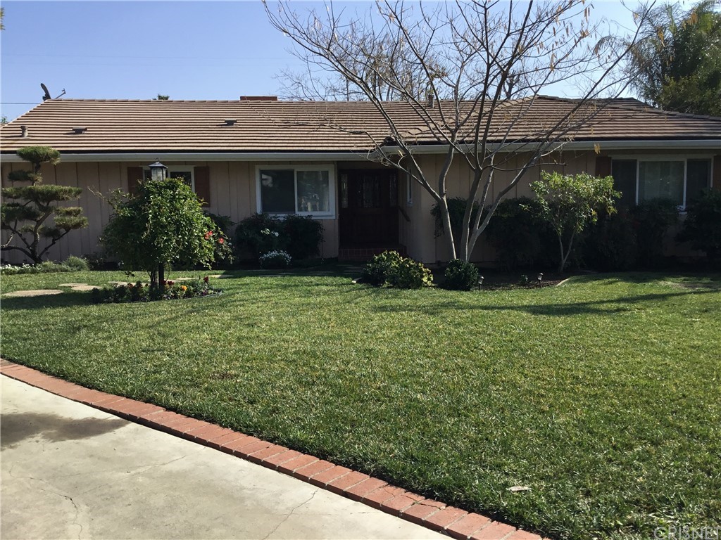 11240 Balcom Avenue Granada Hills, CA 91344 - Photo 2 of 23 a view of a house with yard and a tree