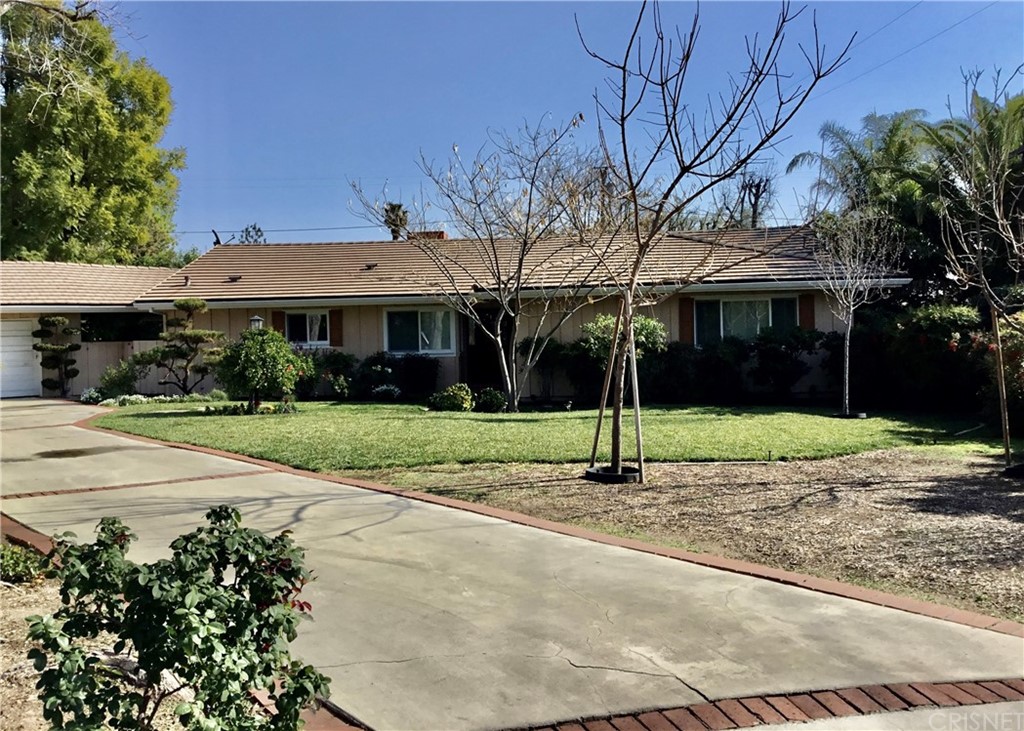 11240 Balcom Avenue Granada Hills, CA 91344 - Photo 3 of 23 a house with tree in front of it