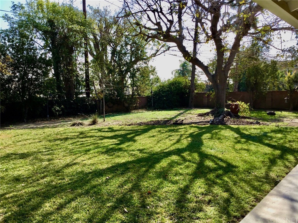 11240 Balcom Avenue Granada Hills, CA 91344 - Photo 8 of 23 a view of outdoor space with deck and tree