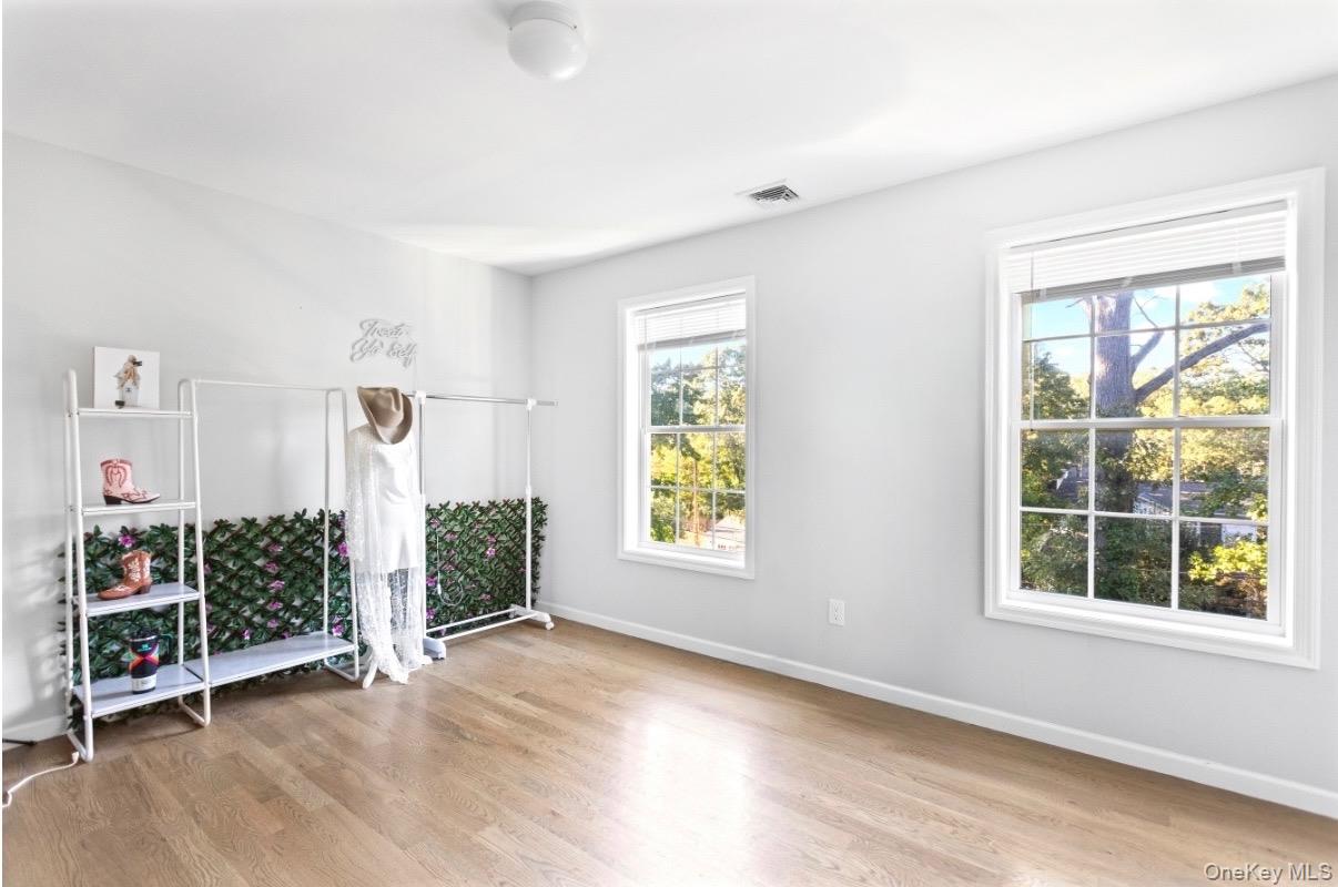 24 Belmont Road Sound Beach, NY 11789 - Photo 16 of 23 an empty room with windows