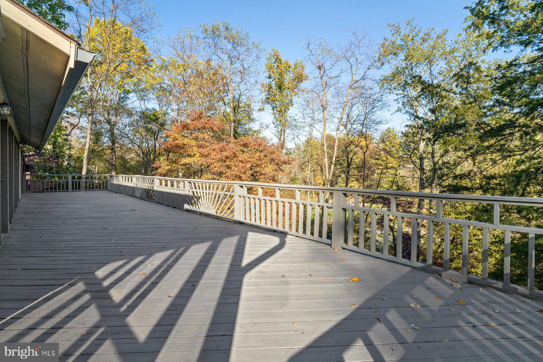 6949 Meadowlake Road New Market, MD 21774 - Photo 31 of 51 Upper deck runs entire length of the home.