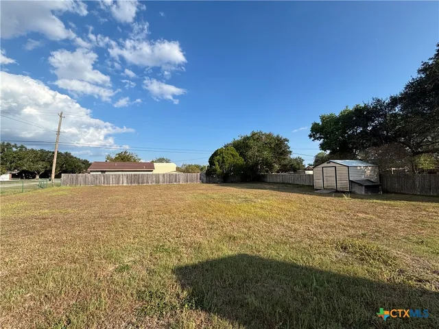 a view of a patio with a yard