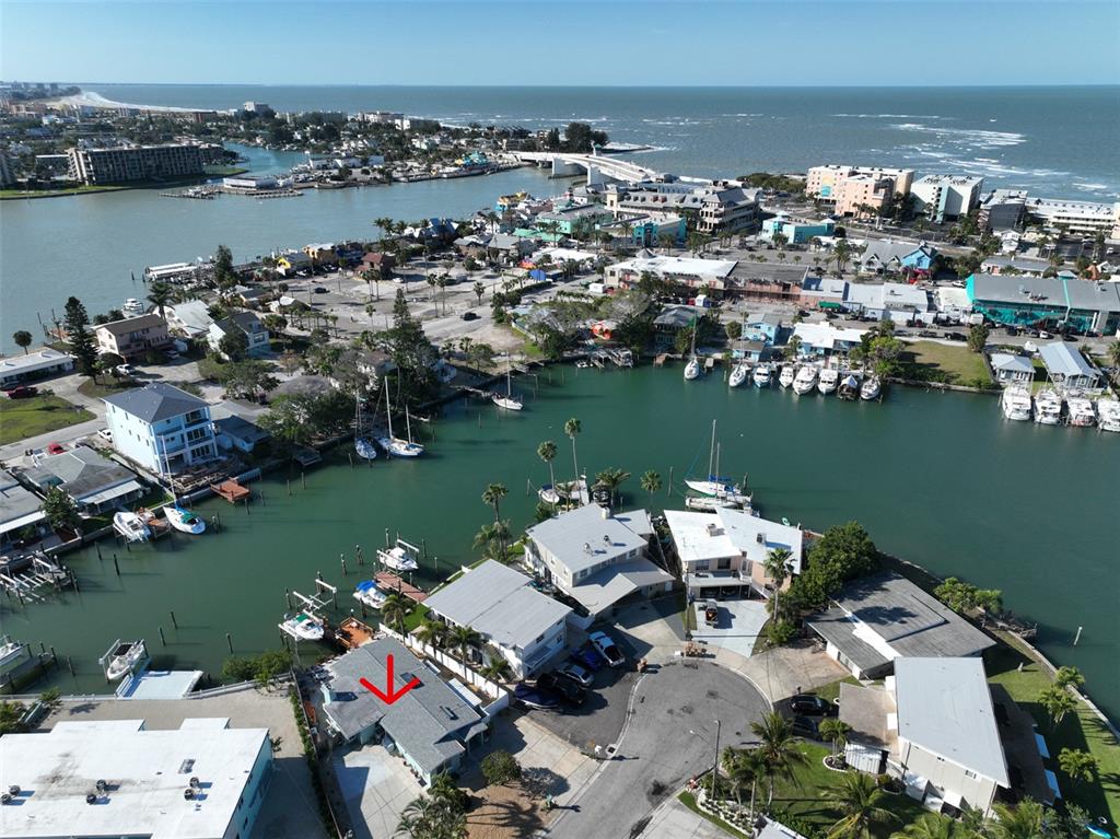 an aerial view of a house with a ocean view