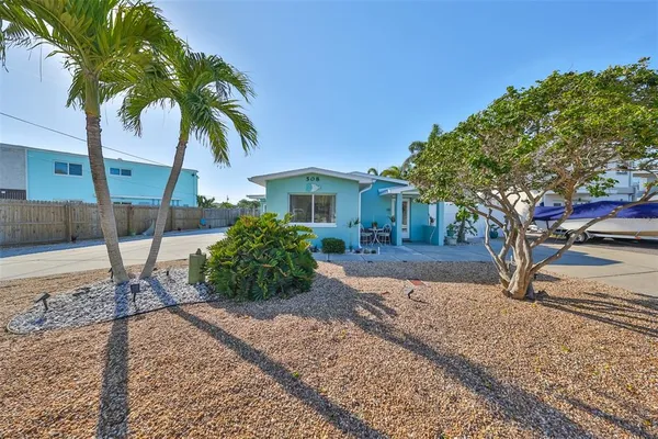a house with a tree in front of it