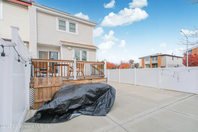 a view of a balcony with furniture