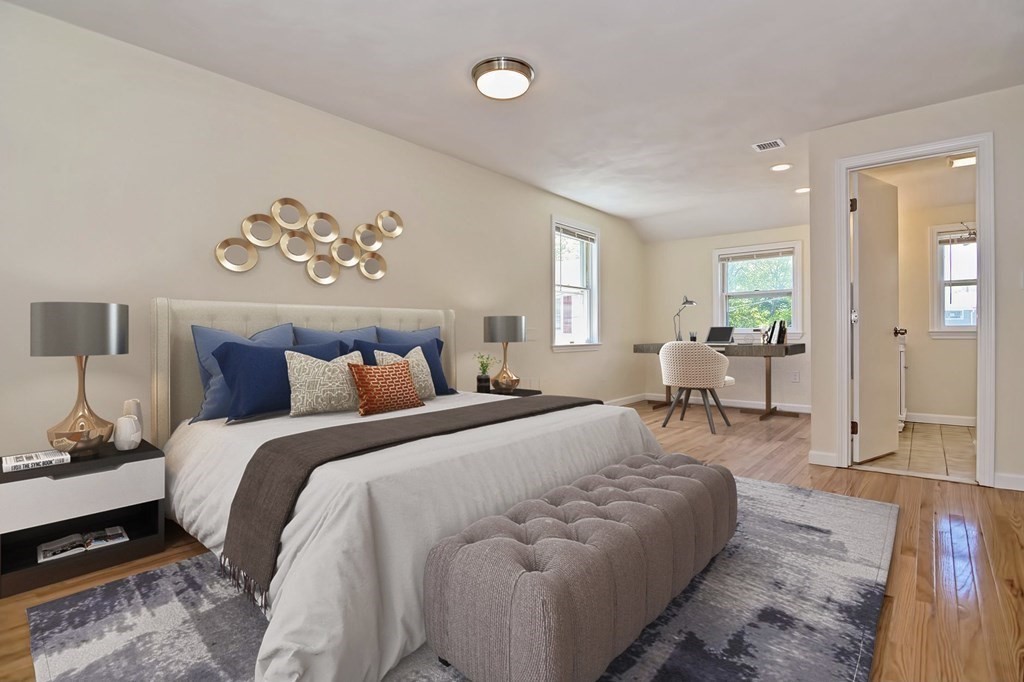 129 Watervale Road, Unit 129 Medford, MA 02155 - Photo 11 of 29 a spacious bedroom with a bed and a table