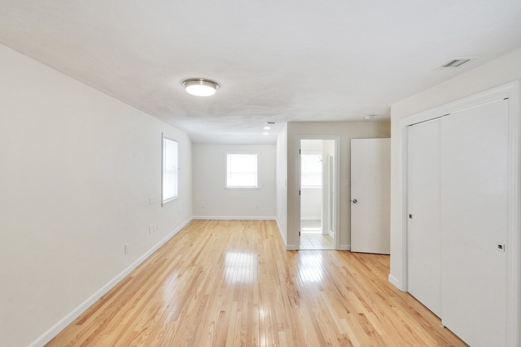 129 Watervale Road, Unit 129 Medford, MA 02155 - Photo 12 of 29 a view of an empty room and window