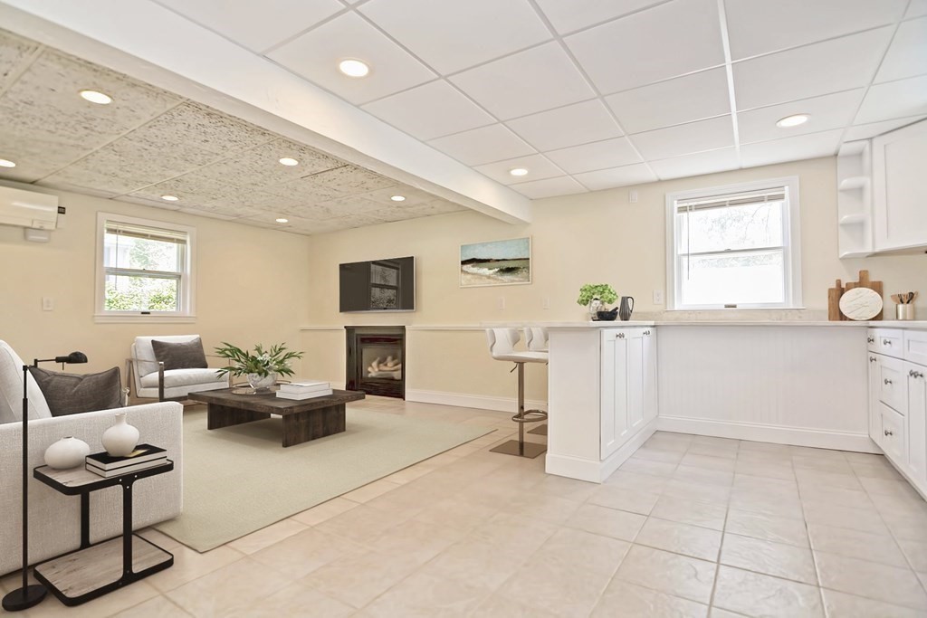 129 Watervale Road, Unit 129 Medford, MA 02155 - Photo 19 of 29 a living room with furniture and a table